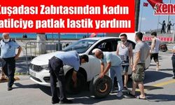 Kuşadası Zabıtasından tatilci kadına patlak lastik yardımı