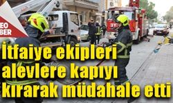 İtfaiye ekipleri alevlere kapıyı kırarak müdahale etti
