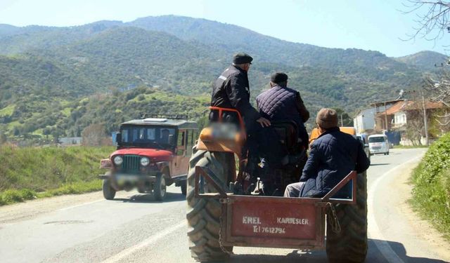 Traktör arkasında tehlikeli yolculuk